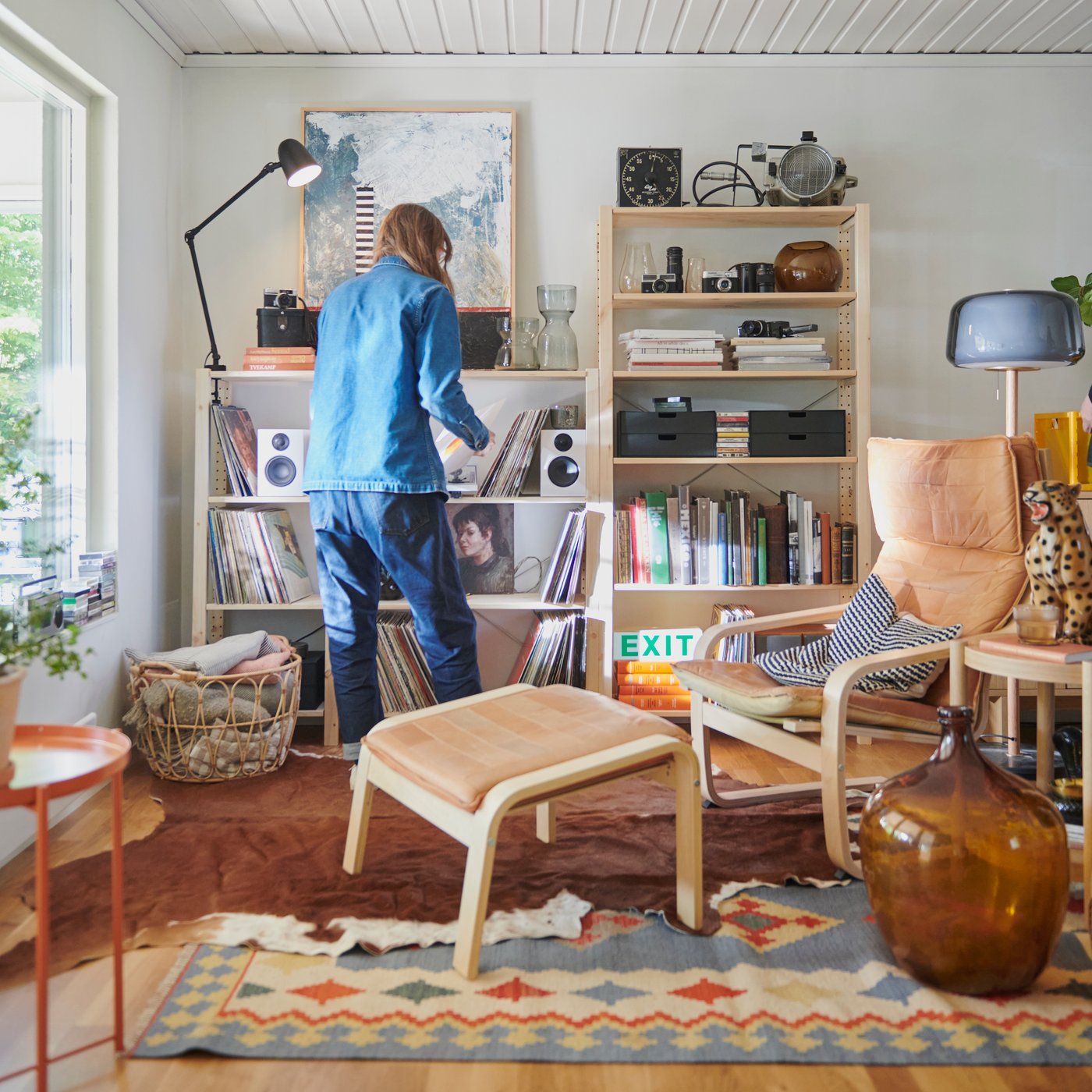 A pine IVAR shelving unit in the living room