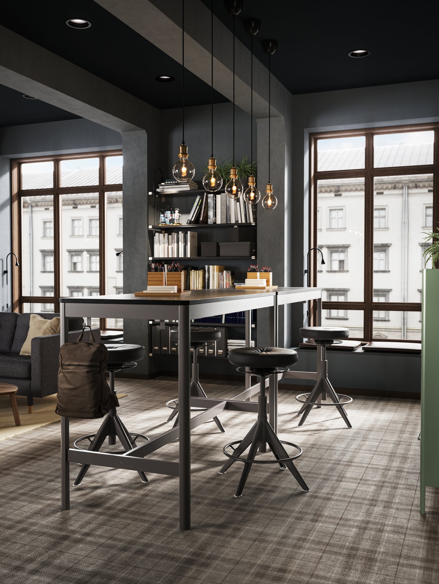 Two black/dark grey IDÅSEN tables are placed together close to a large window creating a standing meeting zone.