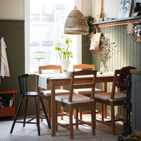 An antique stain pine HÄGERNÄS table and 4 chairs