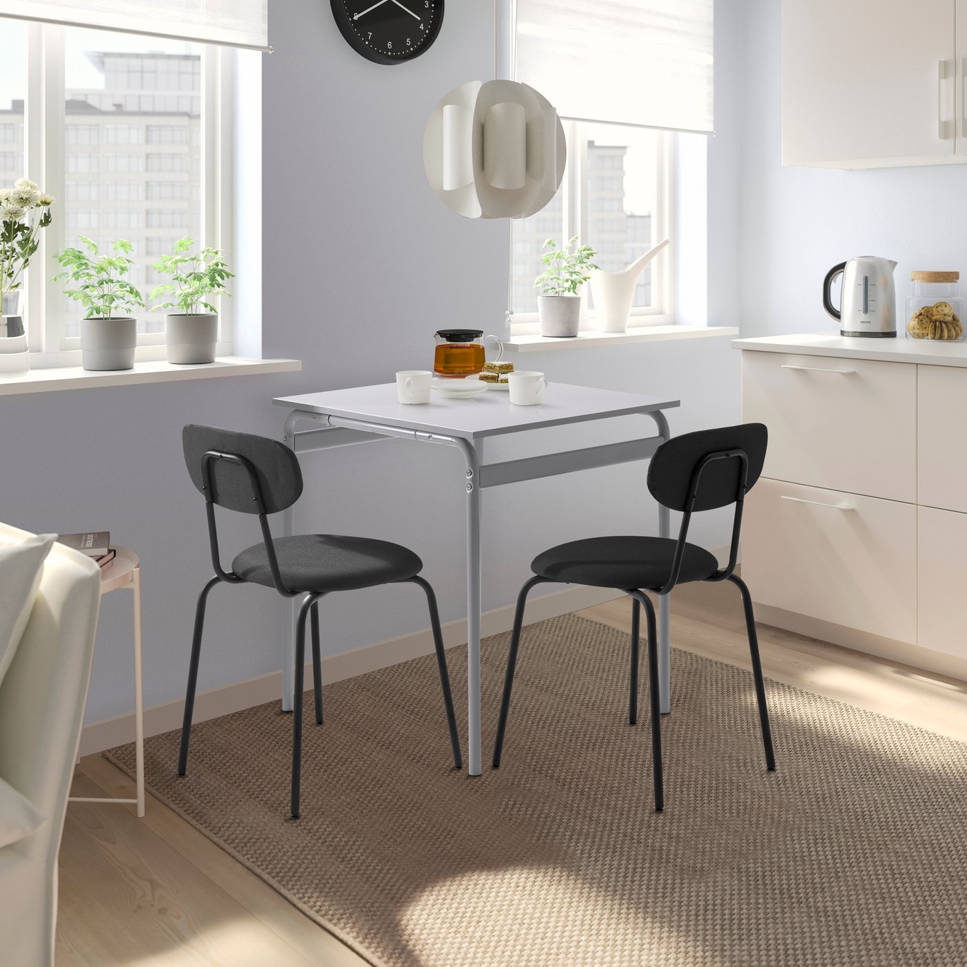 A grey/Remmarn dark grey ÖSTANÖ table and 2 chairs