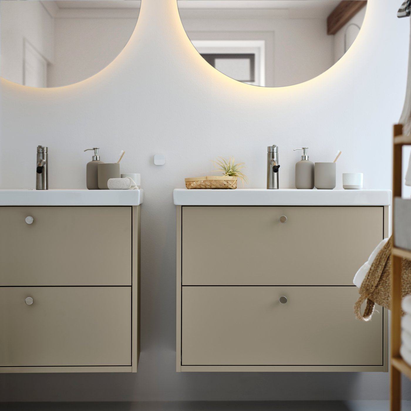 A beige HAVBÄCK wash-stand with drawers in the bathroom