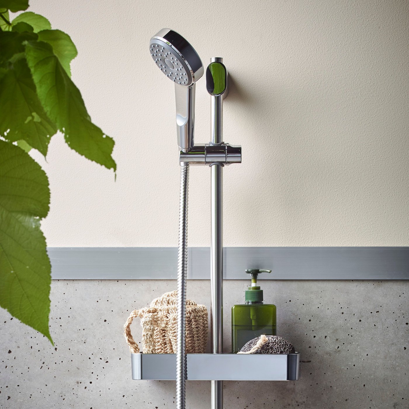 A chrome-plated BROGRUND riser rail with handshower kit in the bathroom
