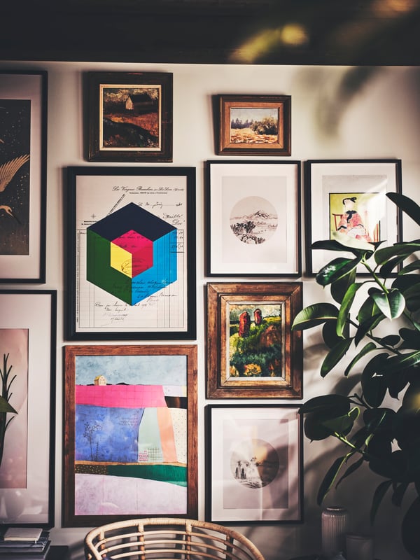 A gallery wall with EDSBRUK and RIBBA frames with BILD posters, and other paintings and illustrations set in FISKBO frames.