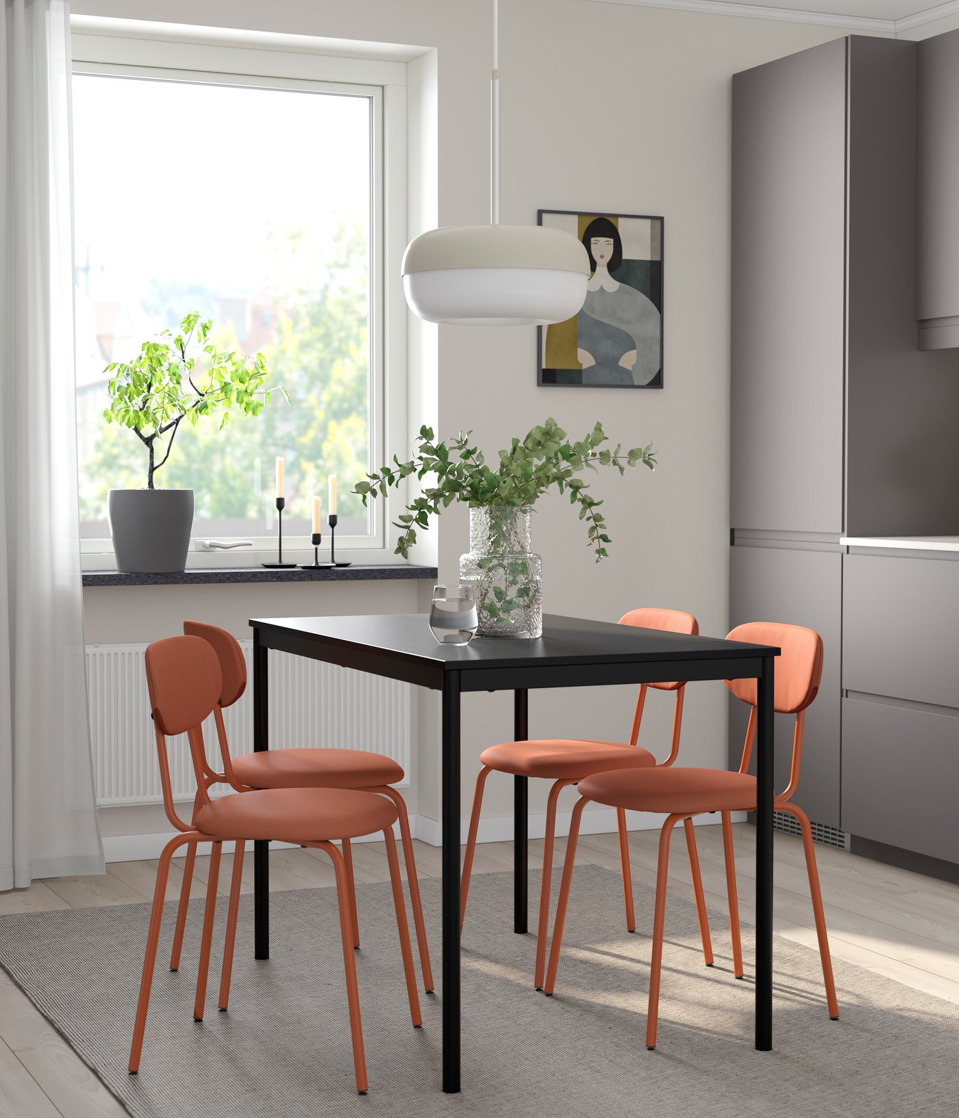 A black black/Remmarn red-brown table and 4 SANDSBERG chairs in the kitchen
