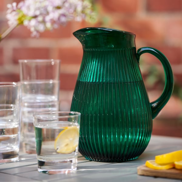 A patterned/green SÄLLSKAPLIG jug in the dining room