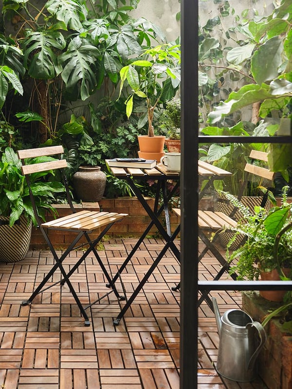 A black/light brown stained TÄRNÖ table, outdoor outside