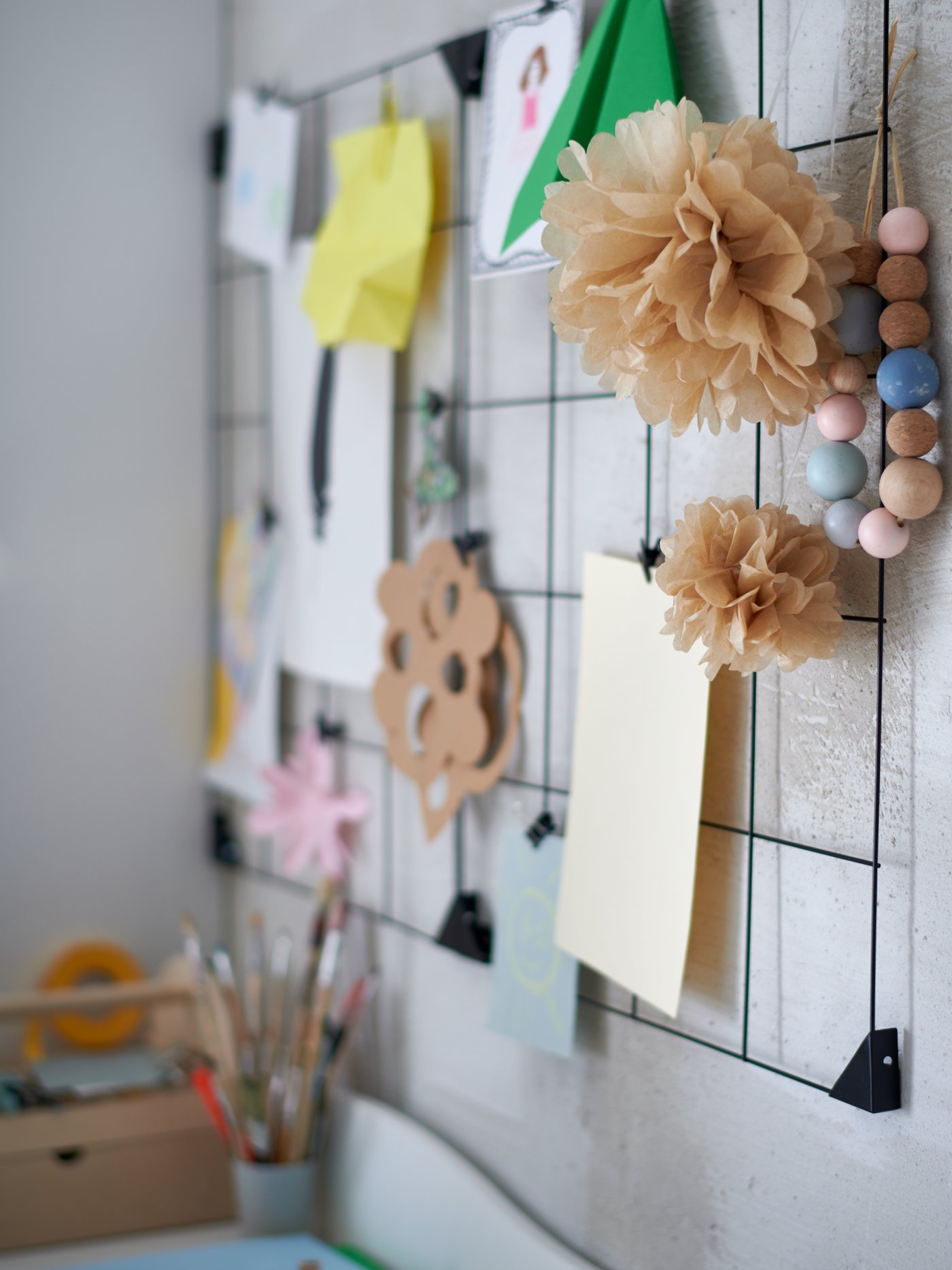A black SÖSDALA memo board with clips in the childrens room