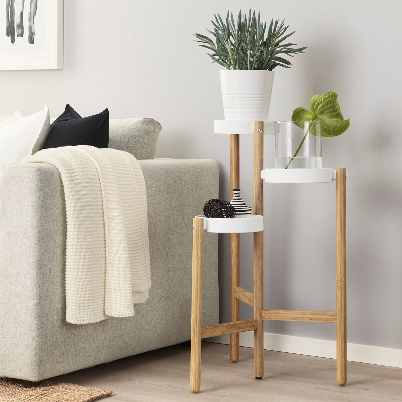 A bamboo/white SATSUMAS plant stand in the living room
