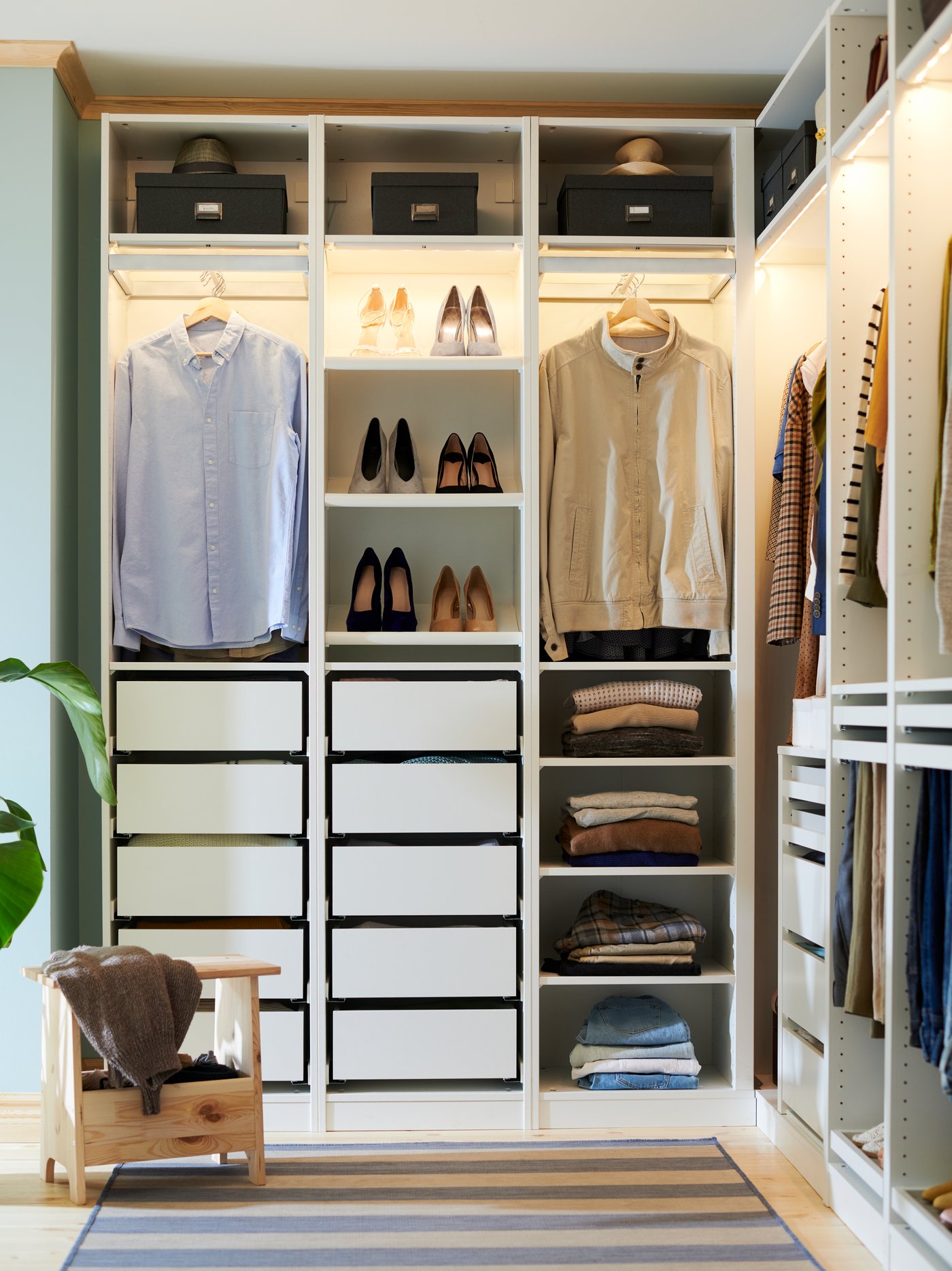 A white PAX corner wardrobe in the bedroom