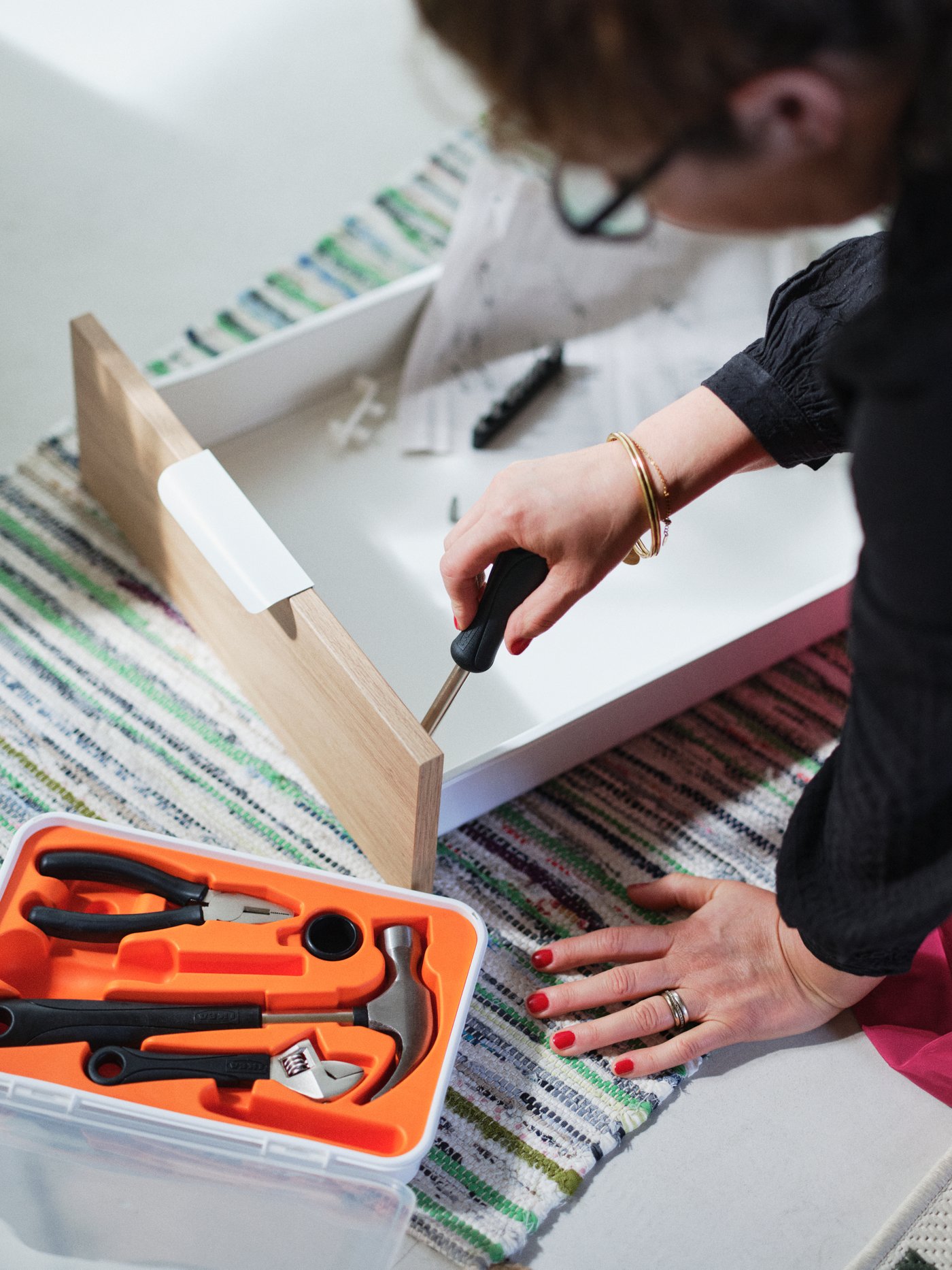 A woman doing DIY with tools.