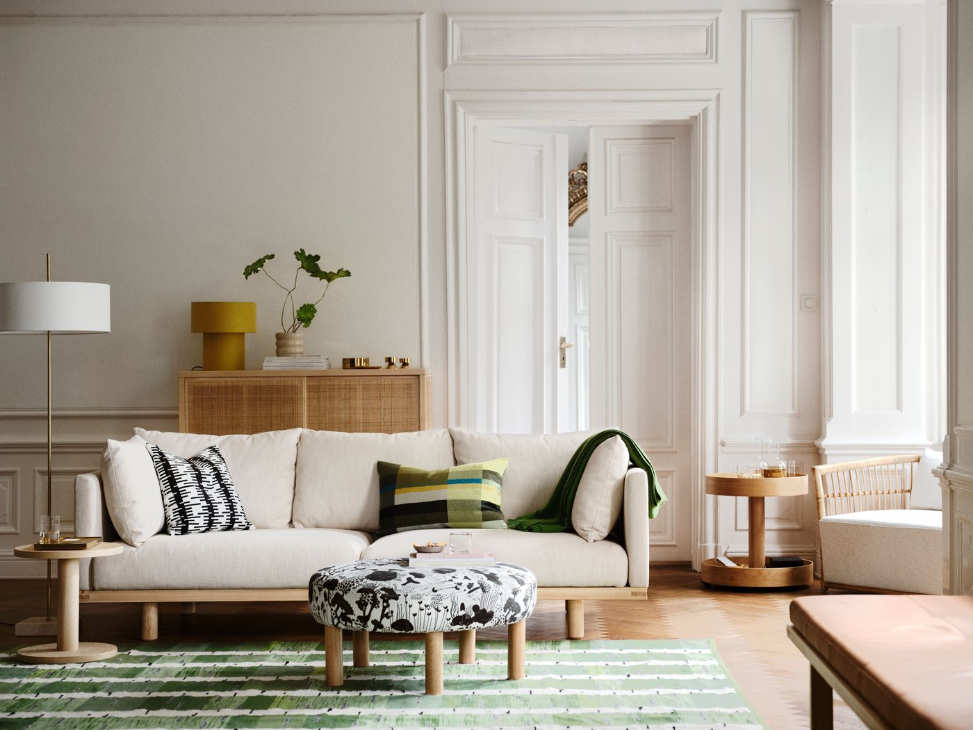 A white textile/brass-plated STOCKHOLM 2025 floor lamp in the living room