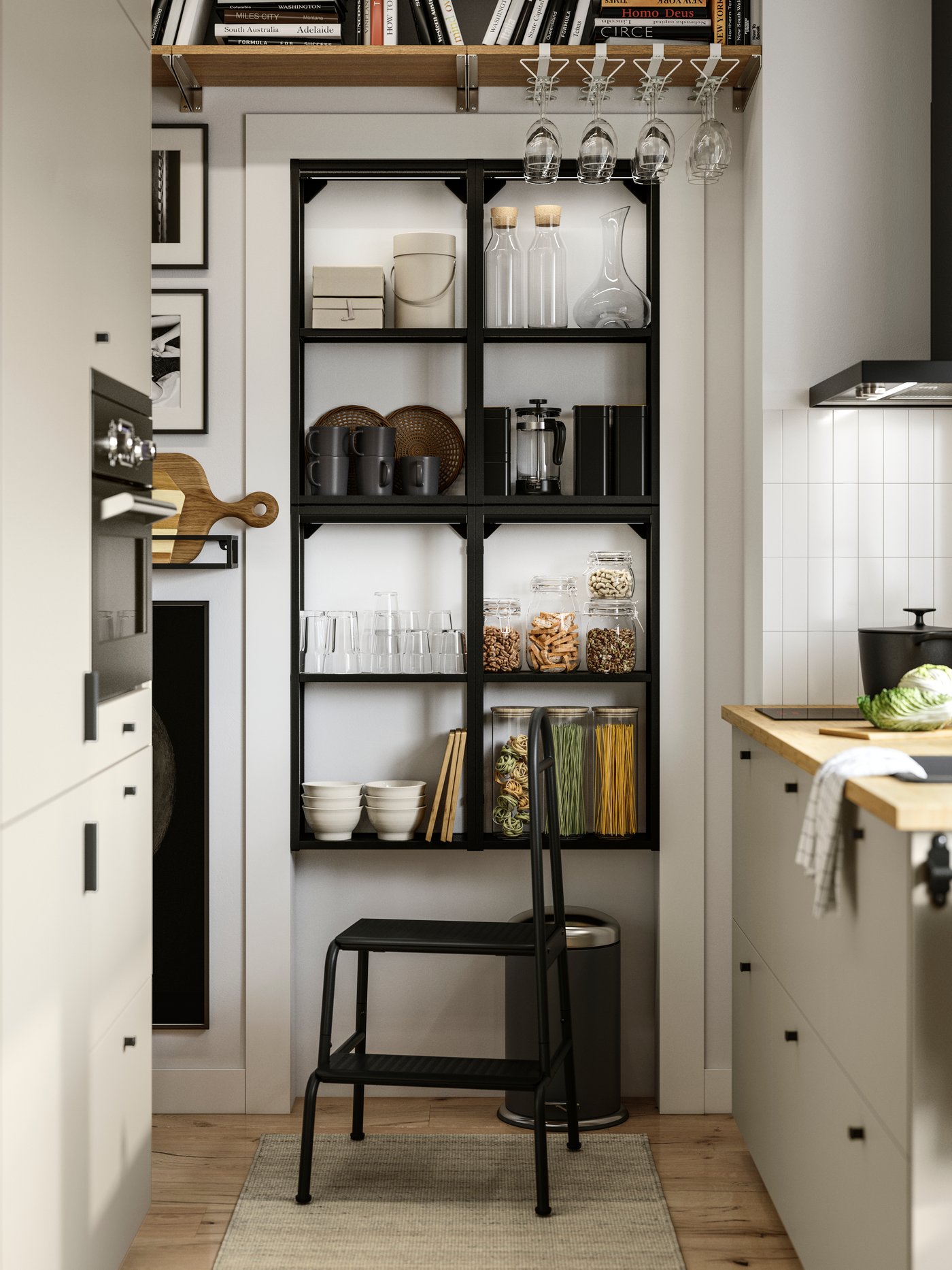 A parallel kitchen with beige HAVSTORP fronts has an ENHET wall frame with shelves in anthracite and a BÄSINGEN step stool.