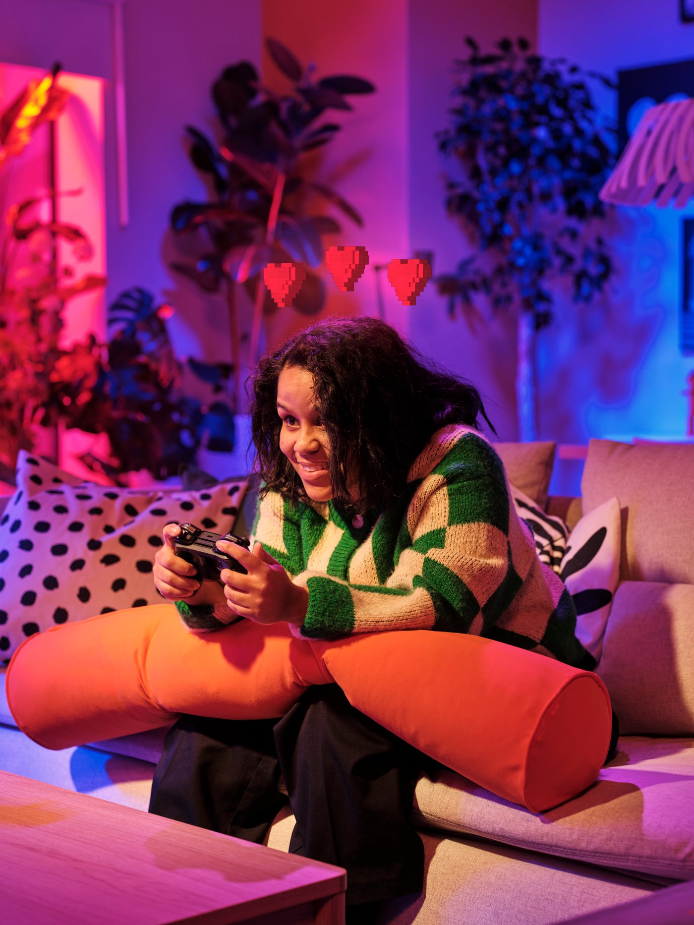 A bright orange BRÄNNBOLL gaming bolster