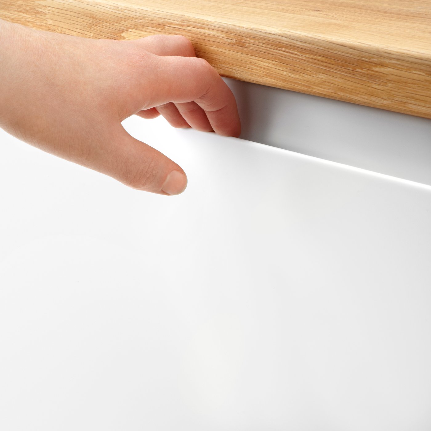 A matt white VOXTORP door