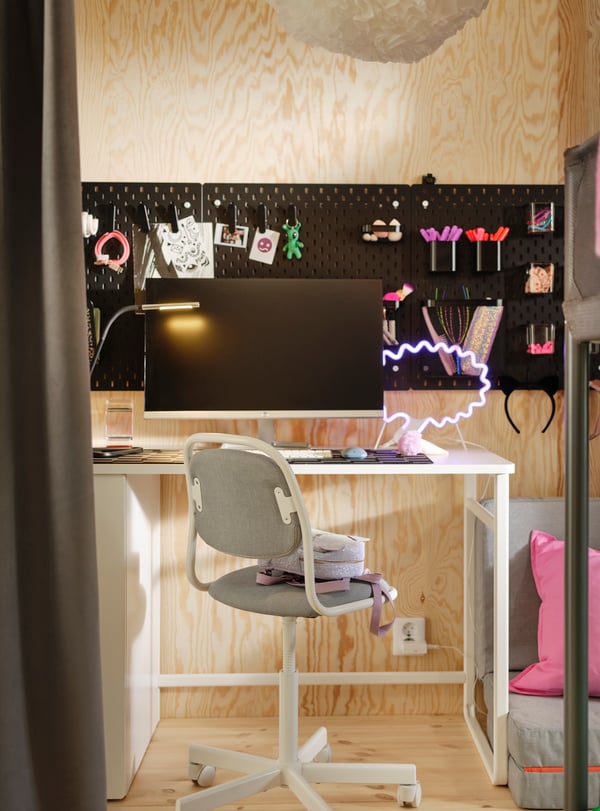 A white LÄRANDE desk with pull-out storage unit