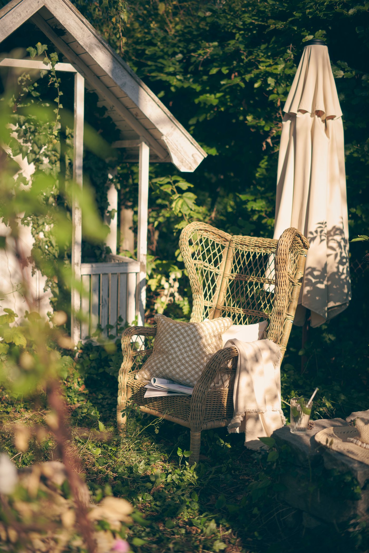A brown RISHOLMEN wing chair, in/outdoor