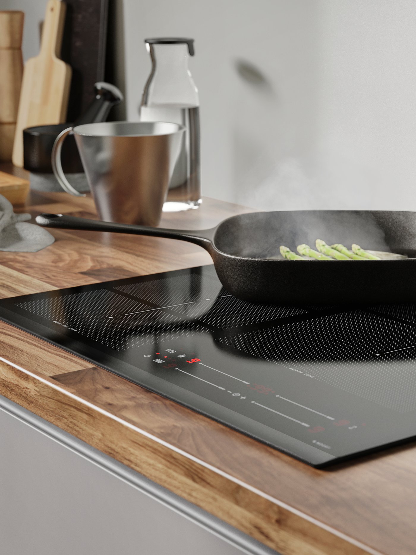 An induction hob on a wooden worktop frying vegetables in a black cast-iron pan.