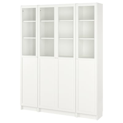 White BILLY bookcase with glass doors, clean design, adjustable shelves.