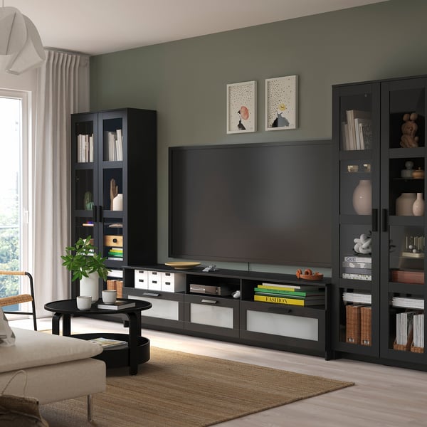 Modern living room with BRIMNES tv unit, console, and decor. Light couch, green wall, large window.