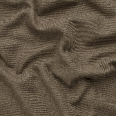 Close-up of recycled polyester fabric, textured and pleated, showing quality and detail.