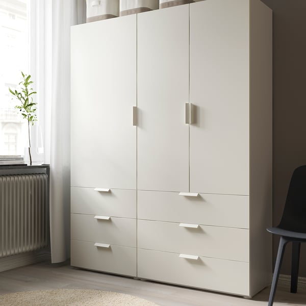 Modern white FONNES chest with six drawers and two cabinet doors. Perfect for storing clothes and fitting various spaces.