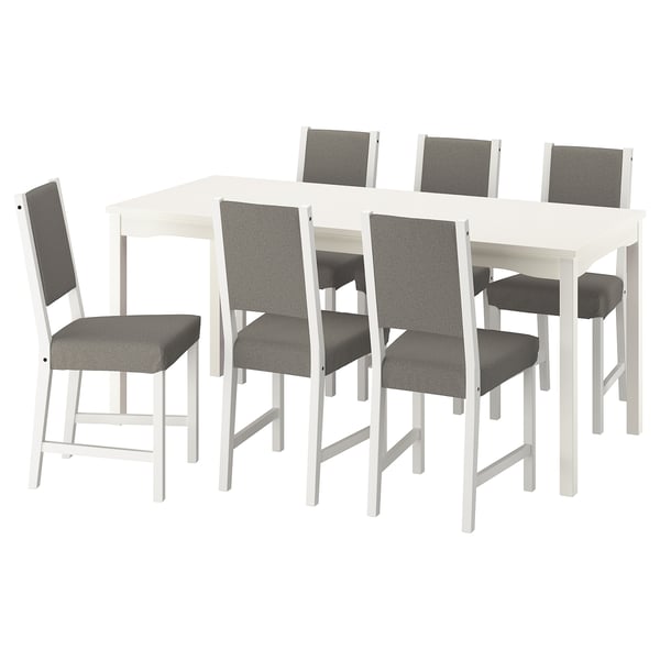 White håuga dining set with 6 grey cushioned chairs.