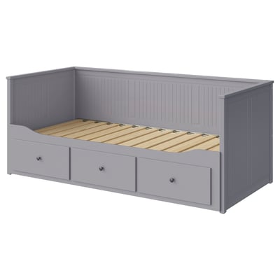 Grey HEMNES day-bed with drawers, wooden frame, upholstered base, rectangular shape, and vertical panel design.