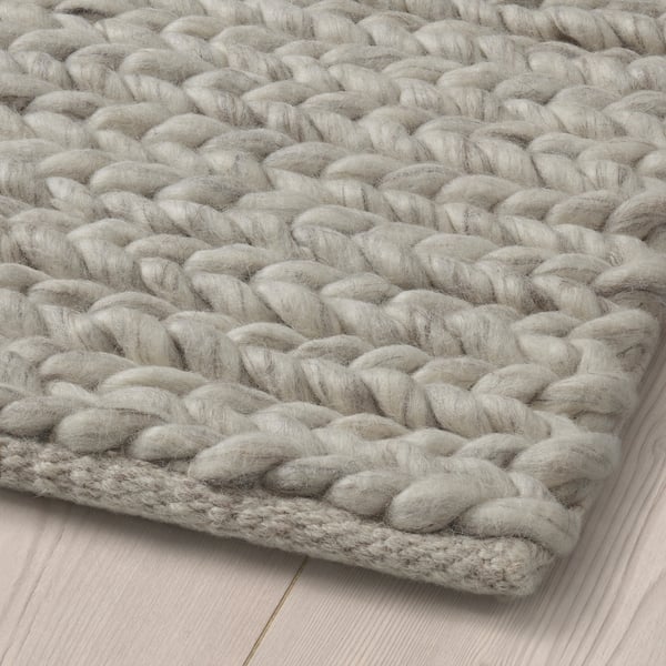 Close-up of handwoven wool rug showcasing high-quality craftsmanship and texture.