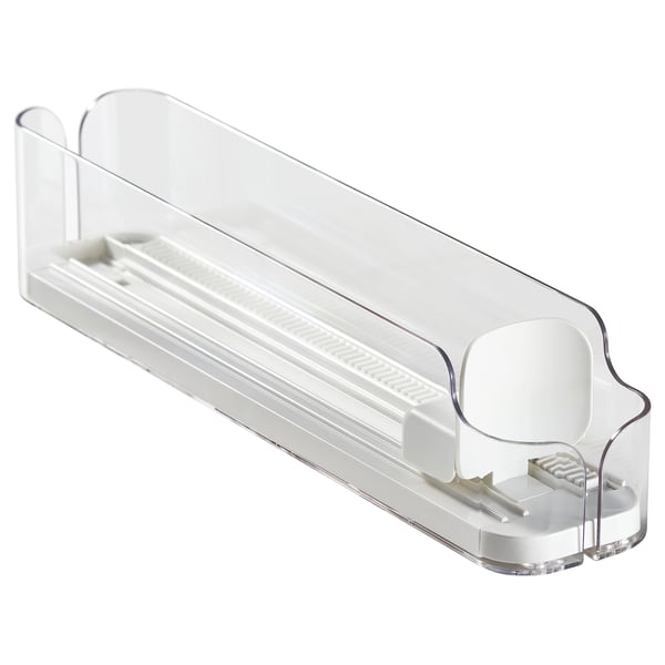 A clear plastic KLIPPKAKTUS drink holder, designed to organise cans and bottles in a fridge. It adjustable sides and a front opening for easy access.