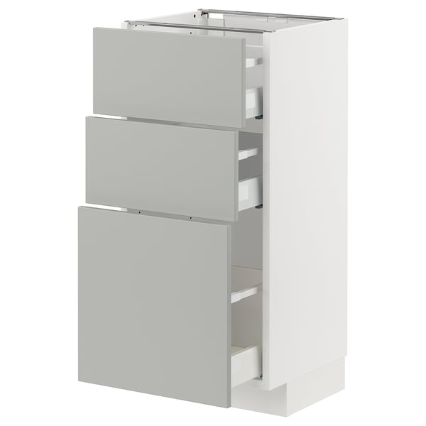 A white ikea METOD kitchen cabinet with light grey havstorp drawer fronts.