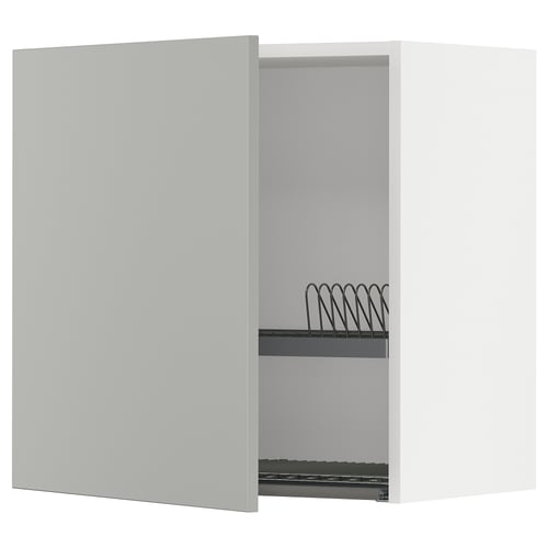 White kitchen cabinet with one door open showing metal wire rack, light grey, modern clean design.