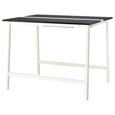 The MITTZON high conference table. It a black tabletop and a white metal frame. The design is modern, suitable for both sitting and standing.
