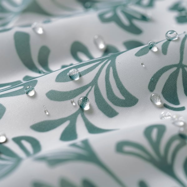 Water repellent shower curtain with leafy design, made from recycled polyester.