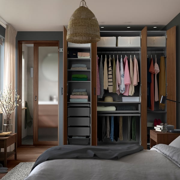 PAX wardrobe with organised clothes and pendant light