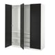 PAX wardrobe: white & black, three sections, open doors exposing shelves and hanging rod.