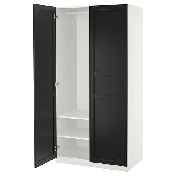 A white PAX wardrobe with black doors, standing vertically. It two open sections with shelves inside.