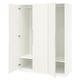 White PAX wardrobe open, showing empty shelves, and soft-close hinges.