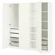 White PAX wardrobe, open showing shelves, drawers, baskets. Modern, minimalist design for organised storage.