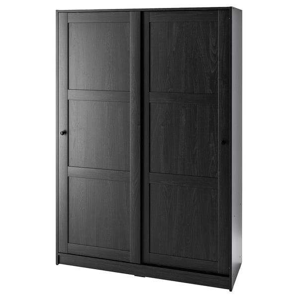 A black RAKKESTAD wardrobe with sliding doors. It has a sleek, rectangular design with dark wood finish.