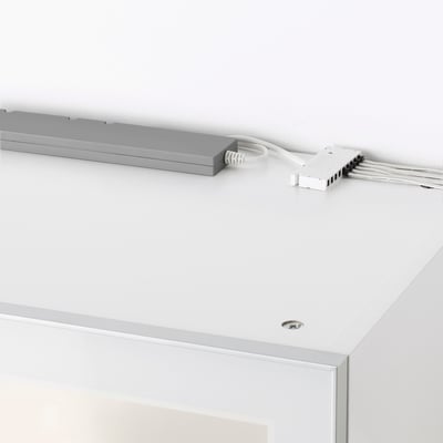 TRÅDFRI led driver on white surface, corded, controls smart lighting.