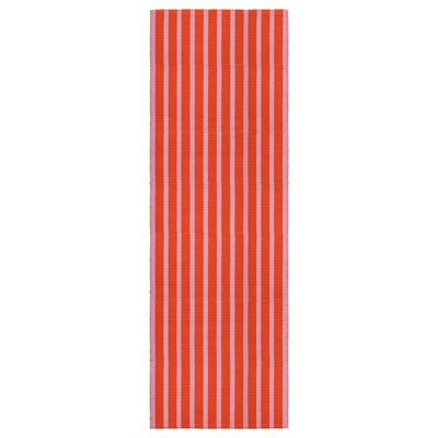 Red and white striped rectangular cotton rug.
