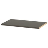 Svart rektangulär hylla, del av BESTÅ-serien, tillverkad med pappersfolie och spånskiva, elegant modern design.