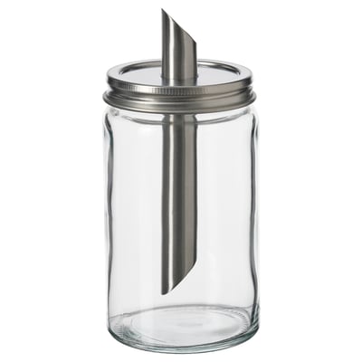 En tom, genomskinlig sockerkarkar, med lock i rostfritt stål och innertub i metall, designad av IKEA.