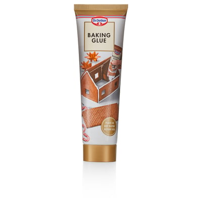 En tub med dr. Oetker baklim, ett livsmedel för att dekorera pepparkakshus, visas upprätt.