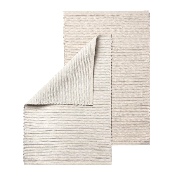 Handvävd beige bomullsmatta, unik design, rektangulär form, mjuk konsistens.