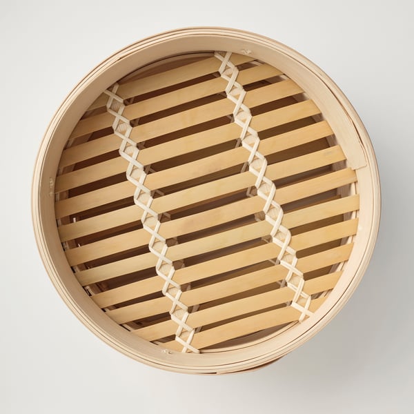 Rund bambuångare med design i två nivåer, perfekt för att laga och servera olika livsmedel, som visar upp kvalitetshantverk och naturmaterial.