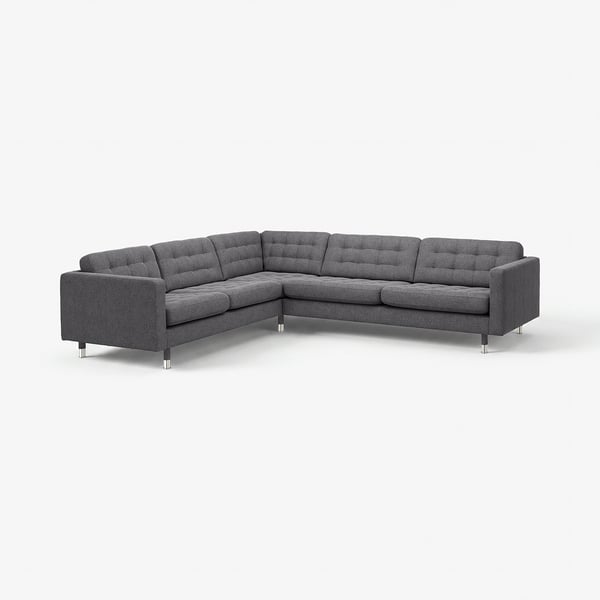 Modern mörkgrå hörnsoffa med kromade ben, tuftad rygg och boxade sittdynor.