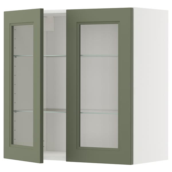 Elegant grönt vägghängt skåp med glasdörrar, elegant design och justerbara hyllor. Perfekt för moderna kök.