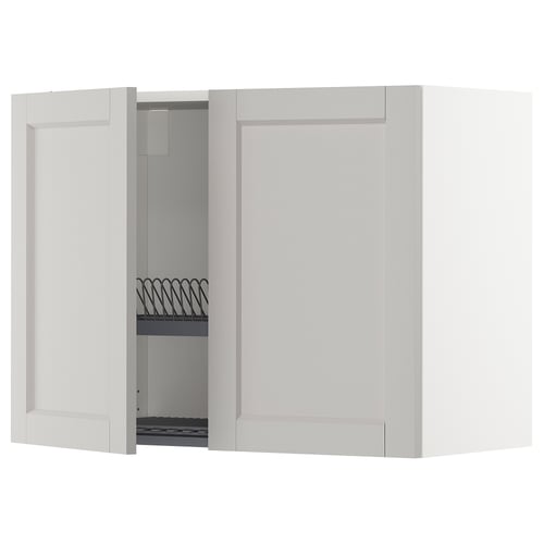 Vitt köksväggskåp, öppen dörr avslöjande hylla med trådfatsavlopp, kantig modern design.