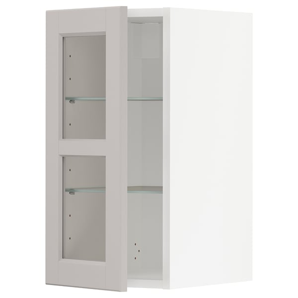 Vitt METOD köksskåp med glasdörrar, traditionell design.